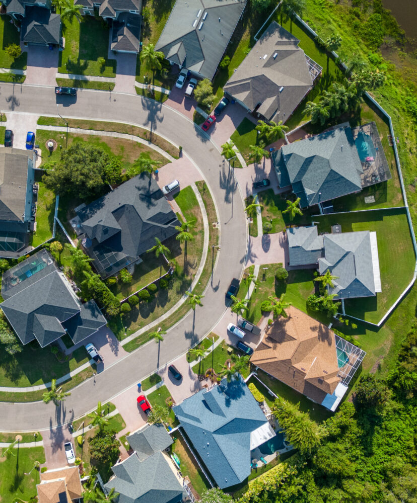 Drone photo of suburban area near New Port Richey Florida with houses and buildings in summer weather